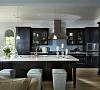 Black cabinetry bring contrast to this modern kitchen.